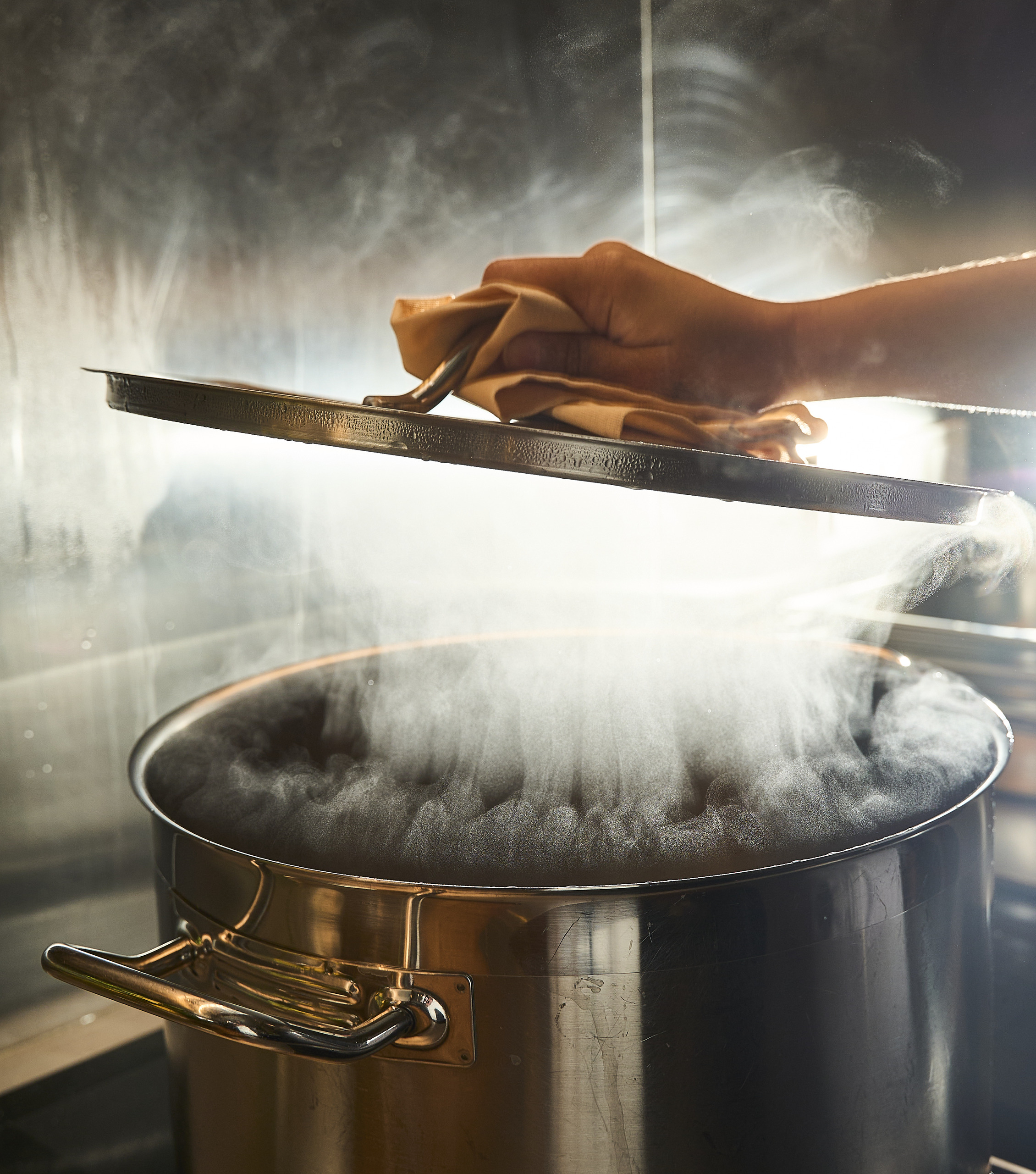 Steam rising from a pot on the stove